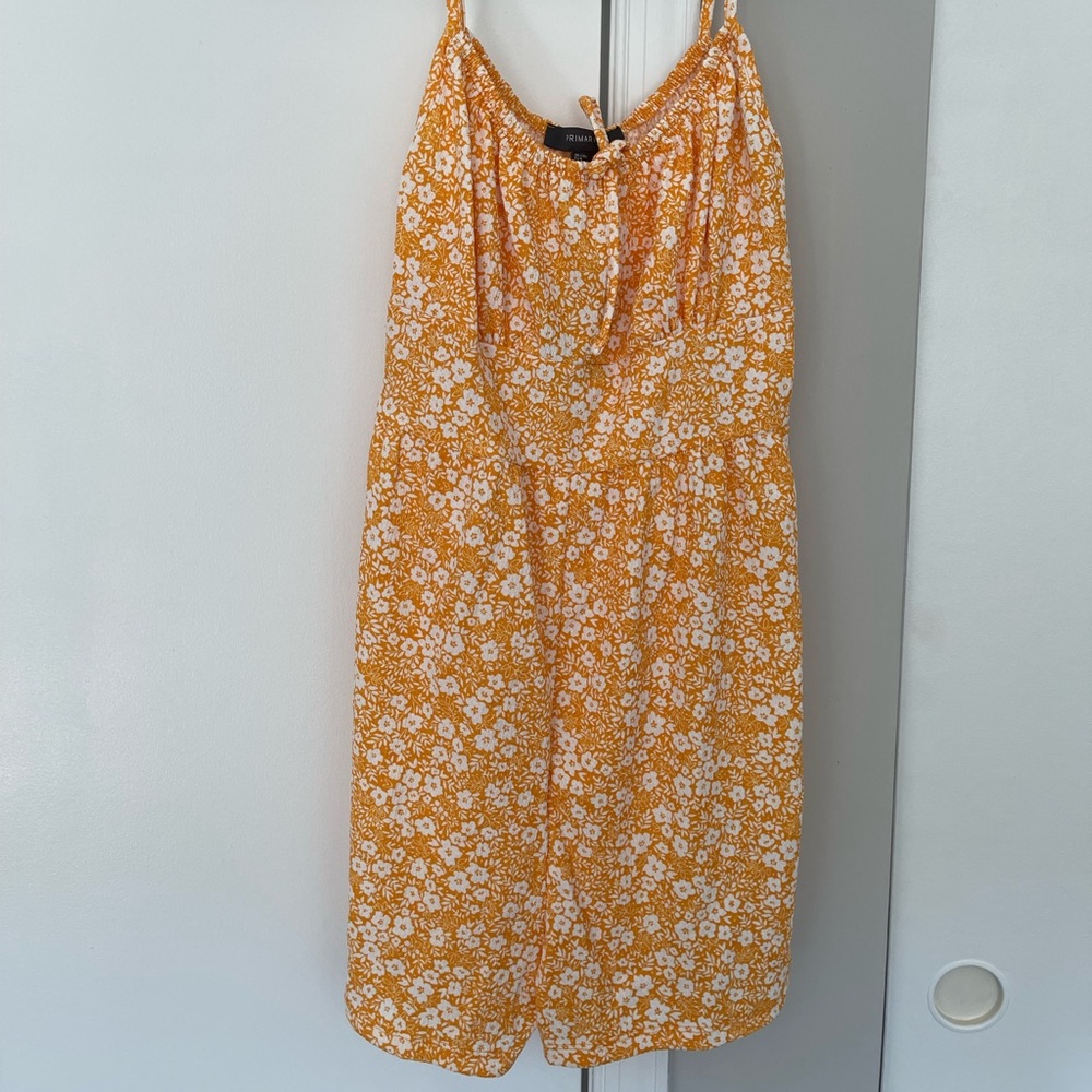Orange/yellow floral romper (never worn)